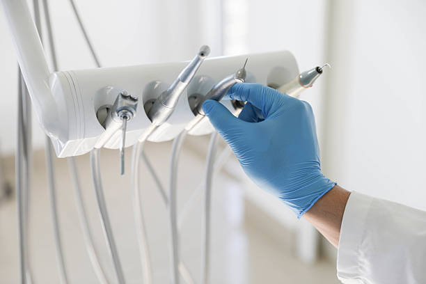 Professional Tooth Extraction technician working in Olympia Heights, FL
